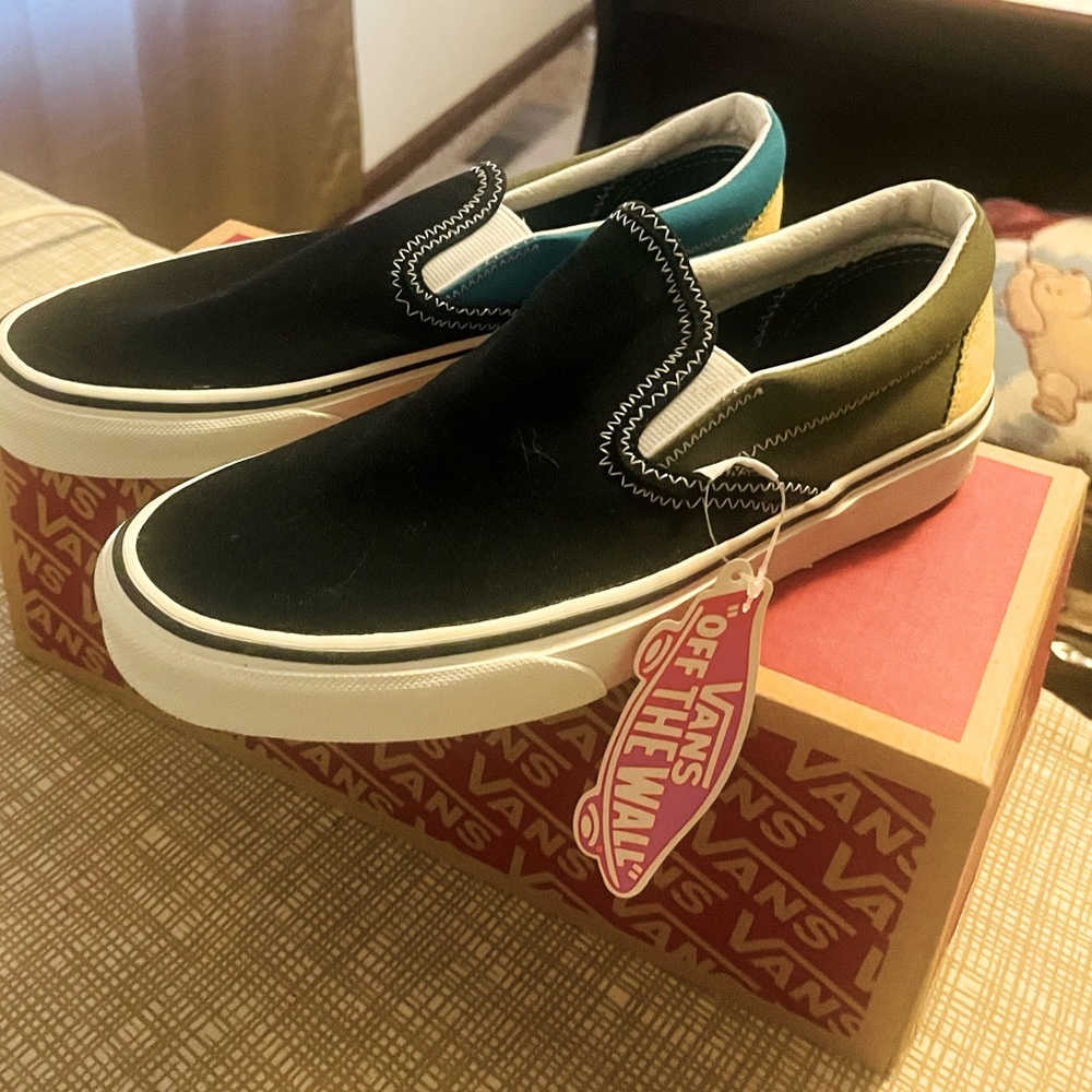 Vans brand new never worn size 6.5 mens and 8 women’s.  Multicolor.